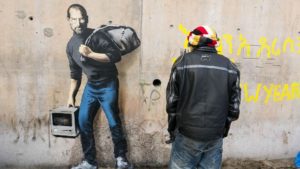 Steve Jobs auf Mauer in Flüchtlingsanlage in Calais